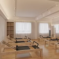 Bright Pilates Studio With Multiple Reformers Wooden Flooring And Large Windows