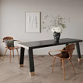 Modern Dining Table Set Featuring Wooden Chairs Black Vase Gray Cushion Gold Base and Framed Art