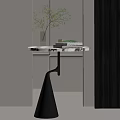 Modern Side Table With Silver Tabletop Black Spiral Base And Green Plant Decor