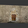 Ancient Stone Building Entrance With Arched Doorway Wooden Door And Stone Steps