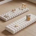 White Long Cushions With Decorative Shells Flower Ornaments And Small Pillows On Wooden Floor