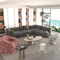 Modern Living Room with Gray L-shaped Sofa Round Coffee Table Decorative Items and Window View