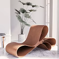 Modern Curved Lounge Chair Interior With Green Plant And Side Table Books