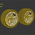Two High Performance Tires With Silver Alloy Wheel Rims And Yellow Brake Calipers