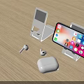 Smartphone On Charging Stand With Wireless Earbuds And Case On Wooden Table