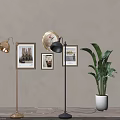 Stylish Gold Black Floor Lamps with Framed Artworks Round Mirror Green Plant in Interior