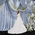 Bridal Photo Check In Spot With Blue Curtain White Flowers And Greenery Decorations
