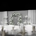 Elegant Banquet Hall With White Floral Decor Wedding Arch Aisle Candles And Chairs