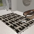 Square Area Rug With Black White Geometric Pattern And Tassel Edges In Modern Living Room