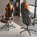 Ergonomic Black And Orange Gaming Chairs In Modern Room With Window And Bookshelf