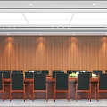 Wooden Paneled Conference Room With Rows of Tables Chairs Green Plants And Ceiling Lighting