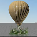 Floral Installation Featuring Yellow Hot Air Balloon with Flowers and Green Plants at Base
