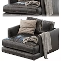 Comfortable Black Leather Accent Chair with Soft Light Gray Pillow and Cozy Gray Throw Blanket