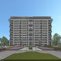 Modern Multi Storey Residential Building Surrounded By Greenery Lawn And Flower Beds Under Blue Sky