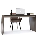 Modern Home Office Desk Setup With Laptop Table Lamp Chair And Stacked Books
