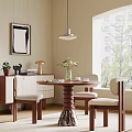Modern Dining Table Set With Round Top Spiral Leg Upholstered Chairs Near Window Plants And Artwork