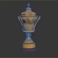 Elegant Golden Trophy With Ornate Carvings Lid Handles And Red Base Design