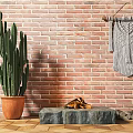 Cactus Potted Plant Against Red Brick Wall with Woven Hanging and Stone Bench Firewood