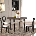 Elegant Round Brown Dining Table And Black Chairs With Golden Leg Accents Sunflowers White Cabinets