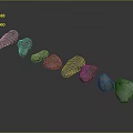 Decorative Green Stone Pieces With White Textures Arranged In Curved Line On Gray Background