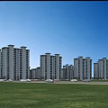 High Rise Residential Buildings Surrounded by Lush Green Trees in Organized Layout