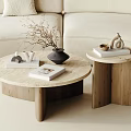 Modern Round Coffee Table With Marble Top Wooden Frame And Decorative Items By Beige Sofa
