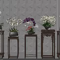 Potted Plants with White and Purple Orchids on Wooden Stands Against Geometric Pattern Wall