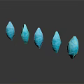Blue Teardrop Shaped Decorative Ornament Set With Five Pieces Arranged On Gray Background And Reflections