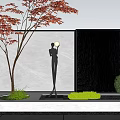 Scenic Waterfall Wall with Black Statue Red Leaf Tree Green Plants and Stone Pavement