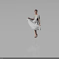 Woman Lifting Patterned Dress Standing With High Heels On Gray Background