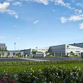 Modern Industrial Factory Building With Green Lawn Flower Beds And Delivery Truck Under Blue Sky