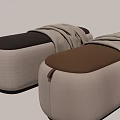 Beige Padded Massage Chair With Brown Leather Accent And Gray Blanket On Top