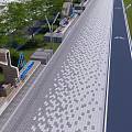 Municipal Road With Patterned Paved Sidewalk Greenery Street Lamps And Signs