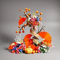 Artistic Floral Display with Orange Fans Pumpkin Fruit Branches and Colorful Blooms