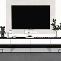 Modern TV Stand With Wall Mounted TV Decorative Items And Green Plant