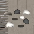 Modern Minimalist Pendant Lights With Organic Pebble Shapes In Neutral Tones And Window Blinds