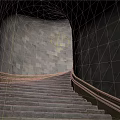 Stone Stairs In Tunnel Like Structure With Stone Walls And Yellow Railings