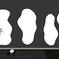 Four Irregular Shaped Mirrors Hanging On Gray Wall With Vase Plant And Wooden Floor