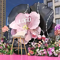 Giant Flower Shaped Photo Check In Spot With Pink Black Petals And White Chair