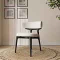 Modern Minimalist Dining Chair With White Upholstered Seat And Black Wooden Frame