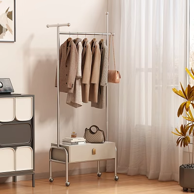 Stylish Clothes Hanging On Floor Standing Rack With Handbag And Small Table In Interior 3d model
