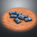 Shiny Black Square Objects Arranged On Smooth Wooden Surface