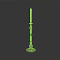 Metal Candle Holder With Decorative Column Base And Lit White Candle On Dark Background