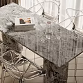 Modern Dining Table Set With Marble Top Transparent Metal Chairs Books Water Jug And Glasses