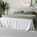 Cozy Modern Double Bed With Green Pillows White Bedspread Round Wall Decor And Indoor Plants