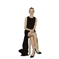 Woman in Black Sleeveless Dress Sitting on Stool with Flowing Skirt and Black High Heels