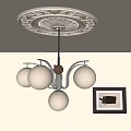 Modern Glass Globe Chandelier with Metal Frame and Ceiling Medallion in Interior with Wall Art