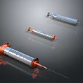 Medical Syringes With Metal Structure And Orange Parts In Different Sizes