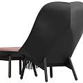 Comfortable Modern Pink Accent Chair With Quilted Backrest Blue Pillow And Fringe Blanket