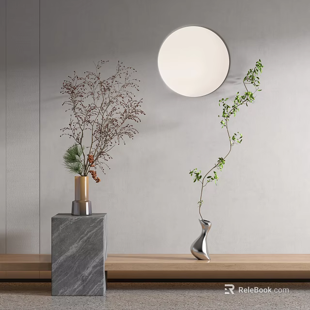 Sculpted Silver Vase With Green Vines And Marble Base On Gray Wall With Round Mirror 3d model 